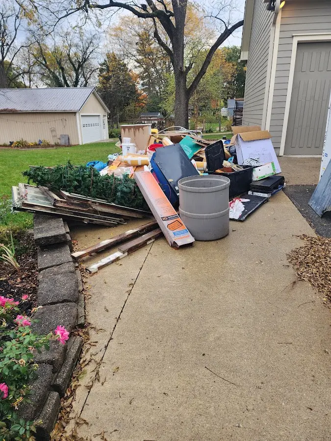 Dumpster being loaded with debris for 30 Yard Dumpster Rental in Burnt Mills
